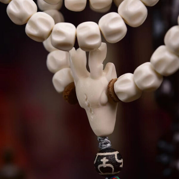 handcrafted tibetan mala beads with 108 passion seeds and deer horn pendant