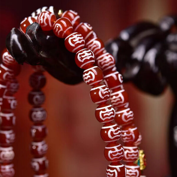 handcrafted tibetan agate dzi bead mala necklace with garuda motif and crystal accents